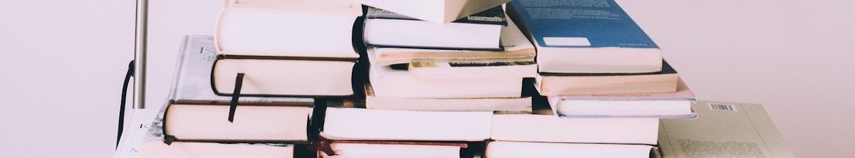 pile of books stacked together