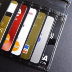 opened wallet containing several credit cards